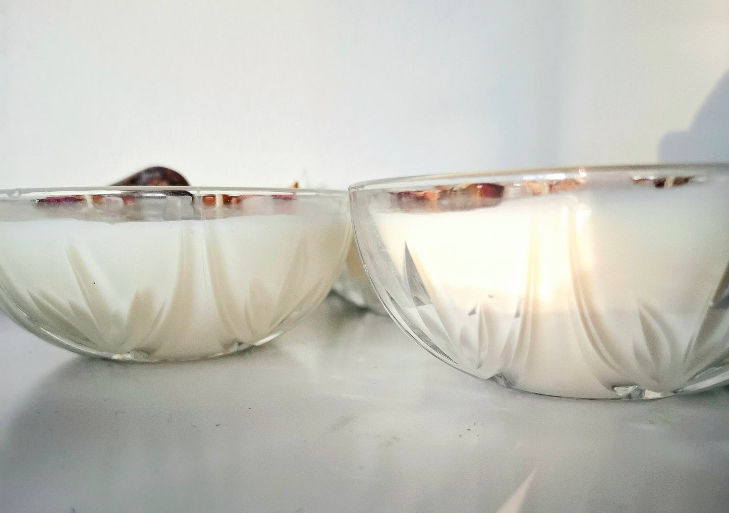Sandalwood and cedar soy wax candle in a Vintage bowl, topped with crystals and dried florals, double cotton wick visible