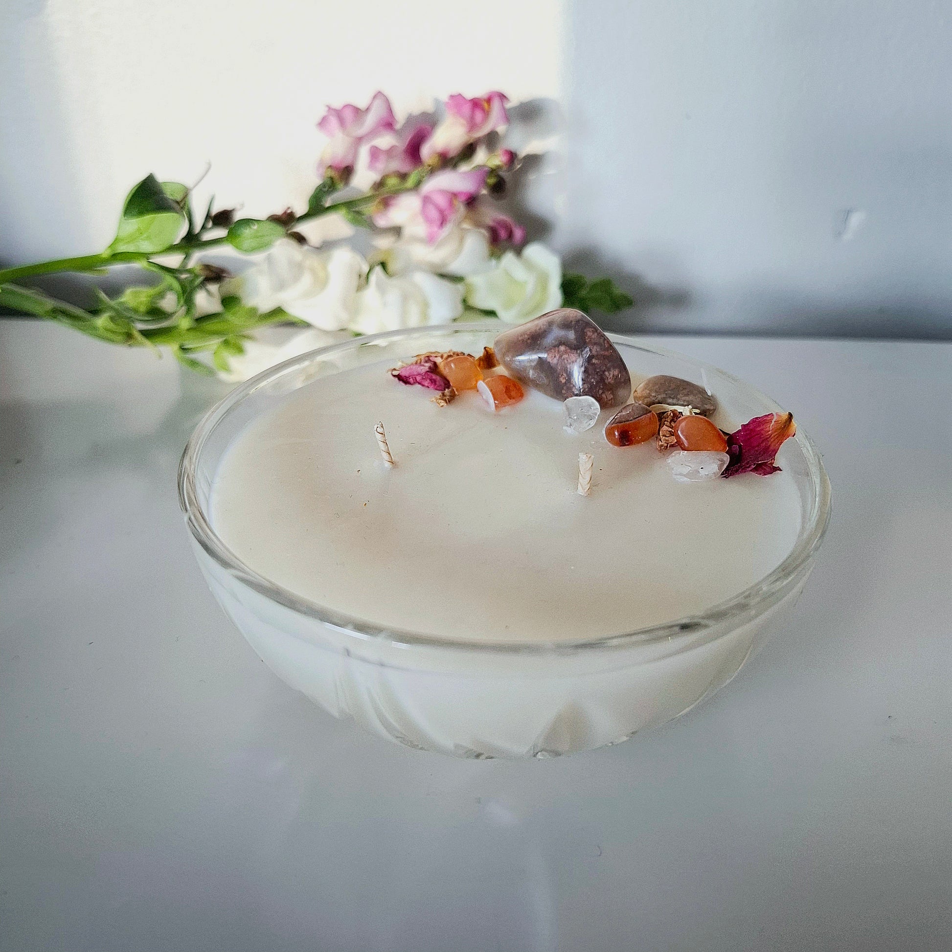 Sandalwood and cedar soy wax candle in a Vintage bowl, topped with crystals and dried florals, double cotton wick visible