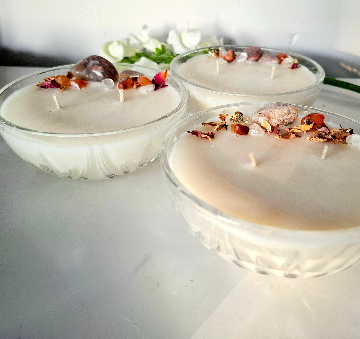 Sandalwood and cedar soy wax candle in a Vintage bowl, topped with crystals and dried florals, double cotton wick visible