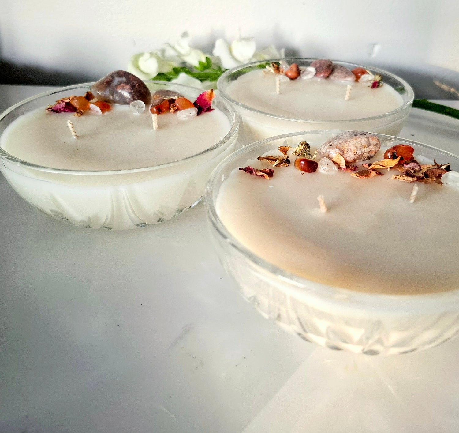 Sandalwood and cedar soy wax candle in a Vintage bowl, topped with crystals and dried florals, double cotton wick visible