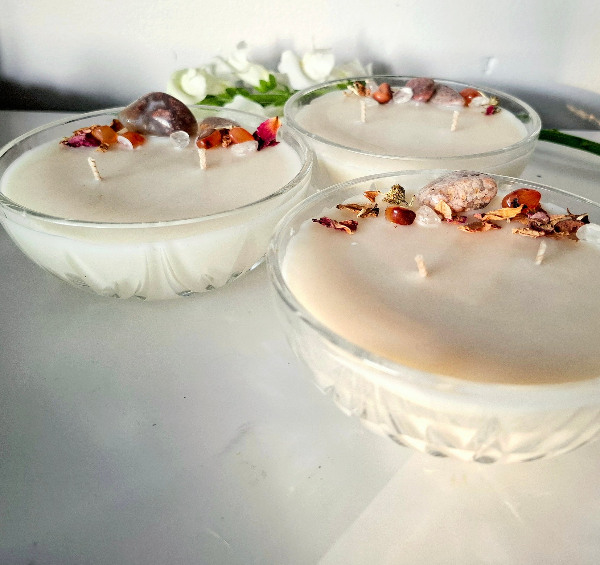 Sandalwood and cedar soy wax candle in a Vintage bowl, topped with crystals and dried florals, double cotton wick visible